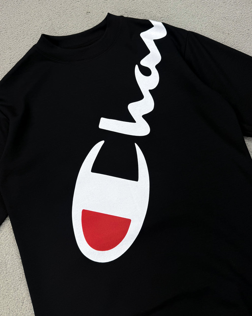 CAMISETA OVERSIZED CHAMP LETREIRO