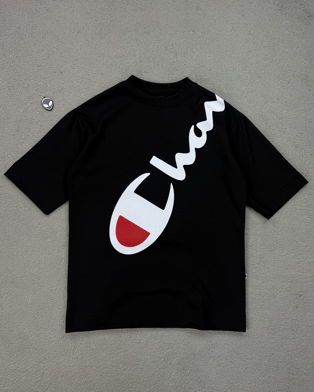 CAMISETA OVERSIZED CHAMP LETREIRO