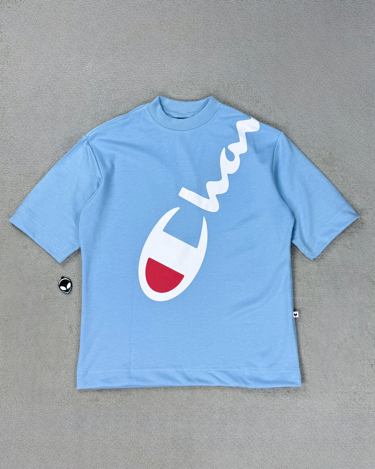 CAMISETA OVERSIZED CHAMP AZUL BEBÊ